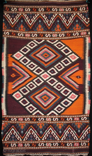 Two small collectible, related but different Helvaci Manastir kilims,the first older with natural orange (or your money back!), the second with interesting asymmetrical colour arrangement in the field, natural and aniline dyes.  ...