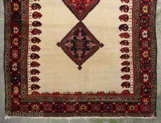 Unique, old and colorful 19th c. Farahan rug (190 cm. x 120 cm.) Lovely piece with soft wool and beautiful dyes on an ivory field. There's a reweave (see last picture), sides  ...