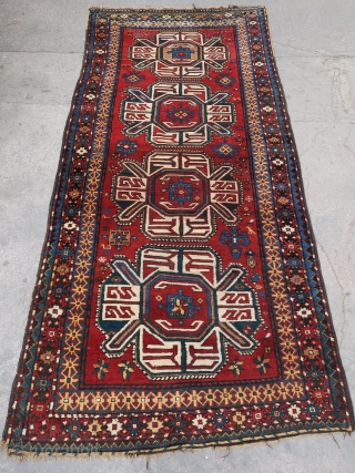 Rare, old and beautiful traditional Karabagh "turtle" 4 medallions rug (270 cm. x 130 cm.) Good condition for its age with high pile all over, some moth bites, few rows of black  ...