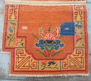 Tibetan horse saddle, it was produced about Early years of the republic of China,orange background with nice grass flower pattern. Good condition and complete one. Size 60*115cm(23*45”)
      