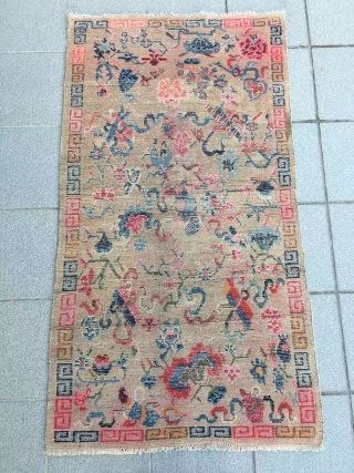 Tibet rug, light camel background with Buddha eight treasures pattern. Size 153*82cm(60*32”). Good age and condition.                 