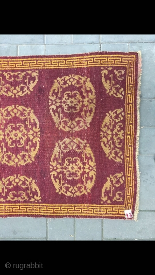 Tibet rug, red background with medallion flowers , good age and condition. Size 90*155cm(35*60”)                   