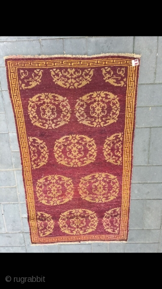 Tibet rug, red background with medallion flowers , good age and condition. Size 90*155cm(35*60”)                   