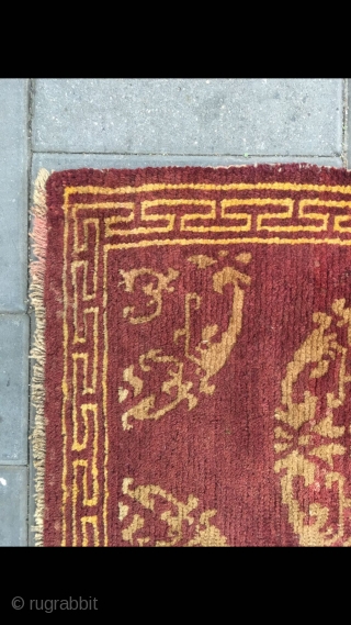 Tibet rug, red background with medallion flowers , good age and condition. Size 90*155cm(35*60”)                   