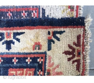 Tibet rug, blue background with nice flowers . Good age and condition. Wool warp and weft.size 63*75Cm(25*29”)                