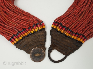 A nice, full multi-strand beaded necklace, Naga people, Northeastern India. Old glass beads, bronze disc, cotton string, 19" (48.2 cm) long. Early to mid-20th century.        