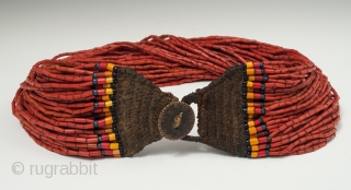 A nice, full multi-strand beaded necklace, Naga people, Northeastern India. Old glass beads, bronze disc, cotton string, 19" (48.2 cm) long. Early to mid-20th century.        