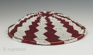 Zulu beer pot cover "Imbenge" made with woven grass covered with very small seed beads. it measures 1.5"(3.3 cm) high x 8" (20.3 cm) diameter. South Africa. Mid-20th century. Ex. David Roberts.  ...