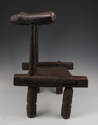 Small chair,
Dan tribe, West Africa.
15" (38 cm) high by 17.75" (45 cm) wide by 12" (30.5 cm) deep.
Mid 20th century.             