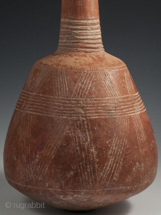 Terracotta Bottle, Djenne area, Mali, 15" (38 cm) high by 24.75" (63 cm) in circumference, late 19th to early-20th century. A handsome terracotta bottle from the Djenne area of Mali with incised  ...
