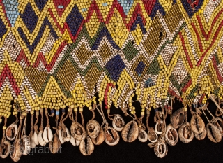 Pikuran (cache-sexe),
Mandara Mountains, Cameroon.
Seed beads, cotton string, cowrie shells, iron bells,
19" (53.3 cm) wide by 9" (23 cm) high.
Mid 20th century. There are a few beads missing here and there, but all  ...