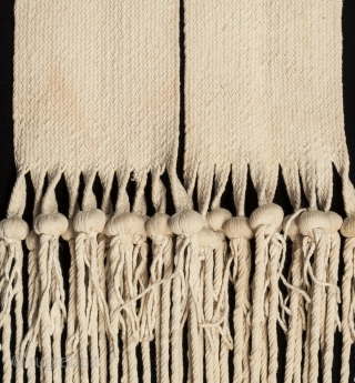 Hopi rain sash, San Juan Pueblo, New Mexico. Hand woven cotton, corn kernels, mid 20th century, 94" (238.6 cm) long by 5.5" (14 cm) wide. Ex. private collection, New York.


This rain sash  ...