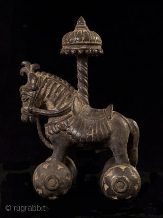 Toy horse with parasol, India.
Bronze.
19th-20th century.
5.5" (14 cm) high. 
The wheels roll freely on this charming toy horse.
#8208               