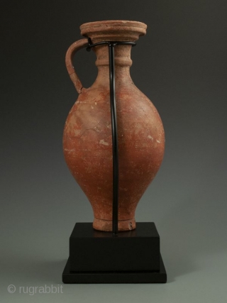 Antique Roman Vase with Stand

Red clay Roman pottery vessel with handle, flanged lip over curved body, worn white design, most likely a wine ewer, display stand.

Provenance Handley Collection 

Date 300 AD 

Size  ...