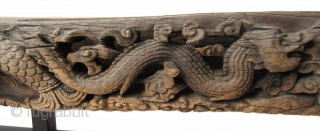 Massive Antique Chinese Architectural Wood Carving of Dragons
An incredibly large and heavy hand carved wood architectural piece, with high relief carved pair of dragons on either side of a central ball of  ...