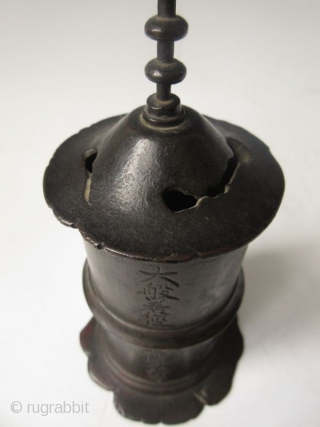 Antique Japanese Bronze Sutra Container

Antique Japanese bronze sutra container of a pagoda form with very tall finial and calligraphy inscription. The bronze shows beautiful green patina inside and on the foot and  ...