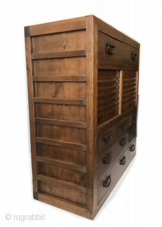 Antique Japanese Choba Tansu
An antique Japanese Choba (merchant) Tansu of hinoki wood and iron hardware. The top section has one large drawer with two handles. The middle section has two sliding doors  ...