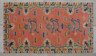 No.CL043 * Tibetan ? Antique "Dragon Face" Rug.Age: 20th Century.Size: 94x162cm ( 3'1" x 5'4" ).Origin: Tibetan Shape: Rectangle  Background Color: Oranges          