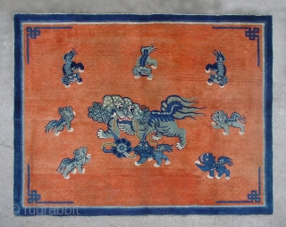 No.CL036 * Chinese Antique "Nine lions" Rug.Size: 147x182cm(4'10"x6').Age: Mid-19th CenturyOrigin: Baotou-Suiyuan.Shape: Rectangle.Background Color: Reds.
In the centre field a sitting Fo-dog is surrounded by eigh fo-dogs. The lion which is mythological animal has  ...