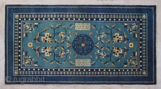 No.P95 * Chinese Antique Rug ,Origin:Beijing.Age:Late 19th Century.
Size:87x161cm(2'10"x5'3").Shape:Rectangle. Background Color: Blues and Greens. 
This sleeping carpet (khaden) has a single central medallion in a double dorje (a Tibetan male symbol) pattern. The  ...