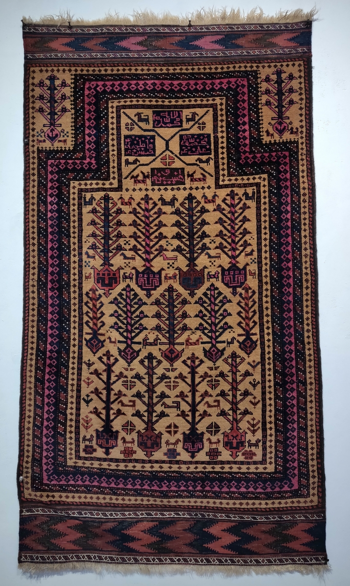 Baluch prayer rug with Shia inscriptions reading 'Allah, Muhammad, Ali, Hasan, Hussein,  Gallery Aydin, Hali Fair, London, 2019